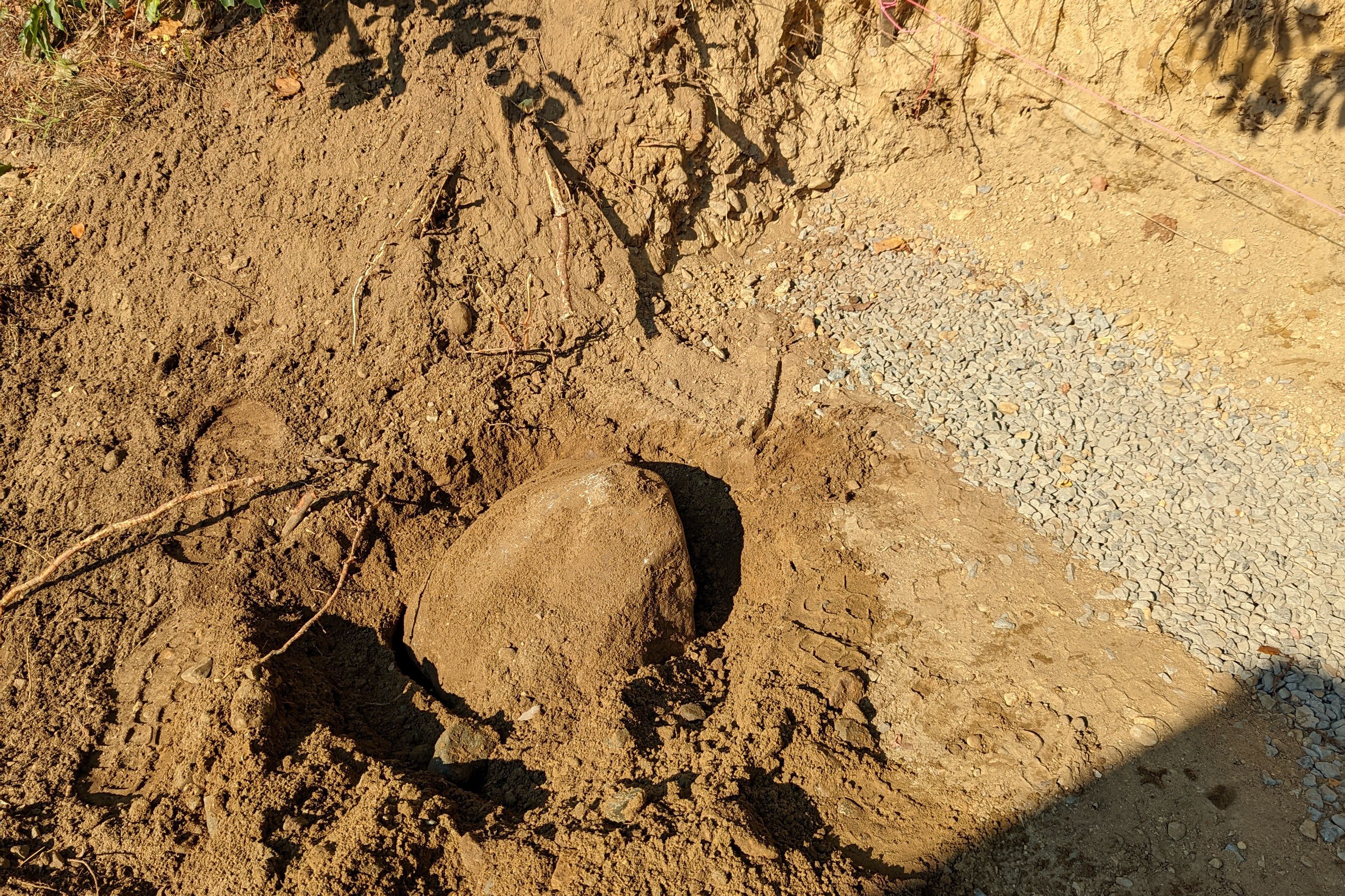 Boulder Uncovered in Ground